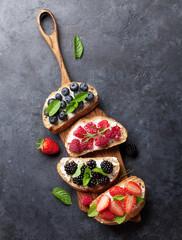 Brushetta or traditional spanish tapas with various berries