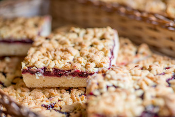 pies and pastries in the basket on the display of the bakery