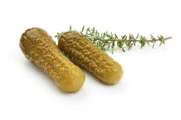 Marinated pickled cucumbers, gherkin, salted cornichon, close-up, isolated on white background