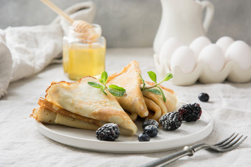 Tasty traditional russian pancakes, honey. Springtime. Shrovetide.