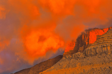Naklejka na ściany i meble Beautifulli illuminated mountain landscape. Ru'us al Jibal. Al Hajar Moutains. Musandam. Oman