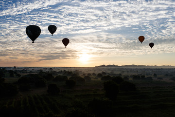 Hot air balloon over plain of Bagan in misty morning, Myanmar