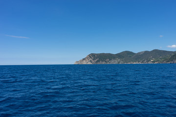 Fototapeta na wymiar Italy,Cinque Terre,Riomaggiore, a large body of water