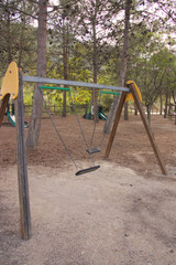 Double swing in a park in a recreational area