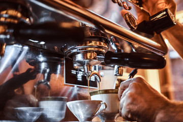 Close-up photo of a coffee machine making a cup of coffee in the restaurant of a coffee shop