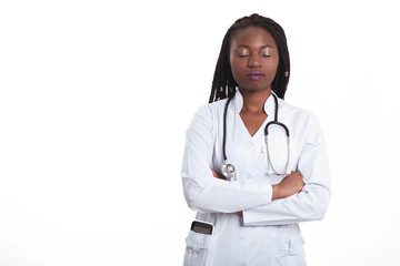 Female american african doctor, nurse woman wearing medical coat with stethoscope and tablet in poket. Serious excited for success medical worker posing on light background