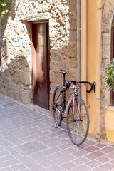 A bike stuck on the street in the old town of Chania (Crete, Greece)