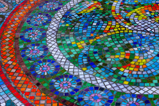 Beautiful colorful round mosaic with bright stones in circular patterns