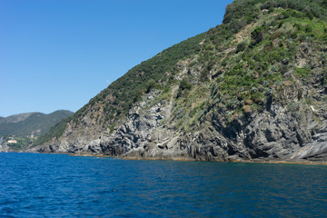 Italy,Cinque Terre,Riomaggiore, a large body of water with a mountain in the background