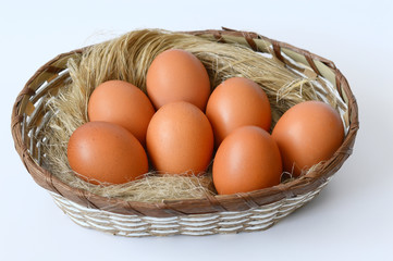 eggs in a basket on a white background
