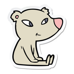 Obraz premium sticker of a cute cartoon bear sitting