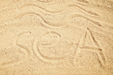 Beautiful drawing on the sand of the sea background