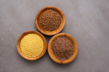 Collection of different groats, buckwheat, flax, in bowls. Set of Groats and Grains.