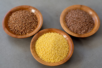 Collection of different groats, buckwheat, flax, in bowls. Set of Groats and Grains.