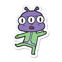 sticker of a cartoon three eyed alien
