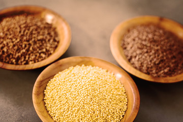 Collection of different groats, buckwheat, flax, in bowls. Set of Groats and Grains.