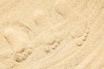 Beautiful drawing on the sand of the sea background