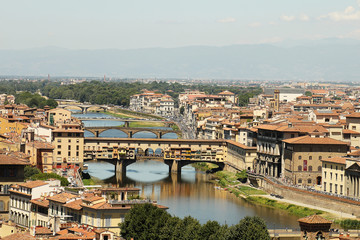 Fototapeta na wymiar yellow roofs and river Florence top view
