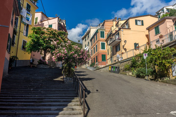 Italy,Cinque Terre,Riomaggiore, a street scene with focus on the side of a building