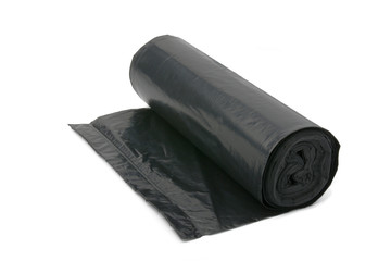 Garbage bag. New roll of plastic garbage bags isolated on white.