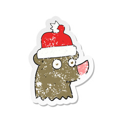 retro distressed sticker of a cartoon bear wearing christmas hat