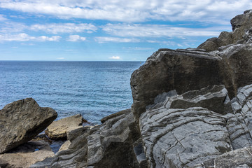 Italy,Cinque Terre,Riomaggiore, a rocky cliff by the water