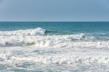 big ocean waves in windsy weather
