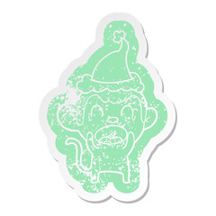 shouting cartoon distressed sticker of a monkey wearing santa hat