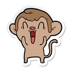 sticker of a cartoon laughing monkey