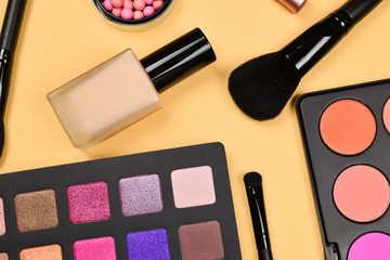 Professional makeup products with cosmetic beauty products, foundation, lipstick,  eye shadows, eye lashes, brushes and tools.