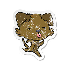 distressed sticker of a cartoon dog sticking out tongue