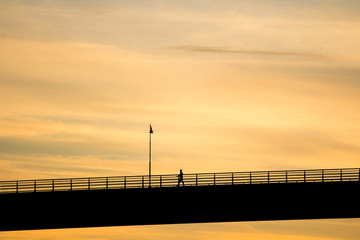 Fototapeta na wymiar man on bridge silhouette