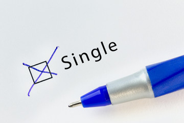 Single - checkbox with a cross on white paper with blue pen. Checklist concept