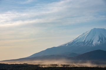 Close up Mount Fuji with natural fine sand flying up in the air. Landscape of The World Heritage. view at Lake Shoji ( Shojiko ) in the morning. Fuji Five Lake region, Minamitsuru, Yamanashi, Japan.