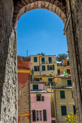 The townscape and cityscape of Vernazza, Cinque Terre, Italy viewed through an arch