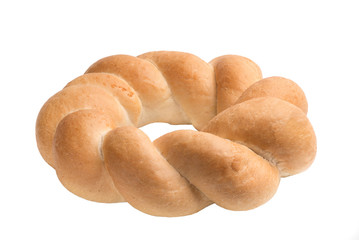 Round challah, braided white bread in the form of a ring, isolated on white background.