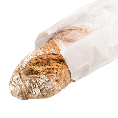 bread with sesame in a paper bag isolated on white background, close up