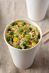 Noodles in a cup, low angle view. Close-up.