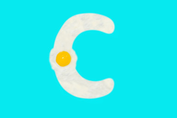 Fried egg in the shape of the letter C