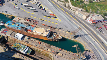 Fototapeta na wymiar Aerial drone top view photo of industrial shipyard located in mediterranean port