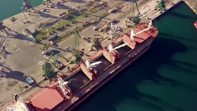 Cranes loadin ship. Aerial view from top