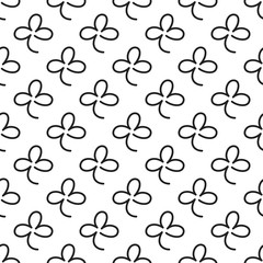 Seamless pattern with line signs of shamrocks.