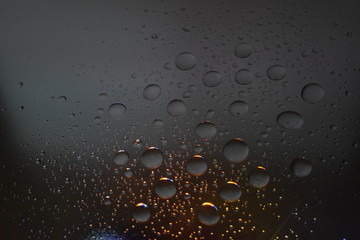 raindrops on a screen/windows background Regentropfen auf einem Fenster