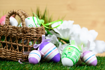 Easter decorative background on grass and wooden floor