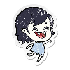 distressed sticker of a cartoon laughing vampire girl