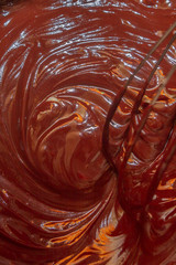 Thorough mixing of the liquid chocolate for dessert cooking