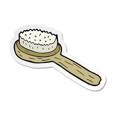 sticker of a cartoon old brush