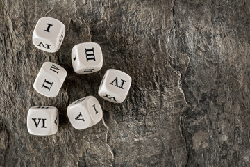 Dice with Roman numerals. Ancient way to address old Latin numbers