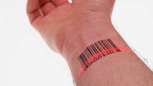 the scanner scans the wrist of a person with a barcode labeled patient 666