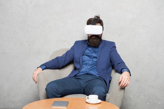 Modern software for business. Business implement modern technology. Businessman sit chair wear hmd explore virtual reality or ar. Business partner interact in virtual reality. New opportunity